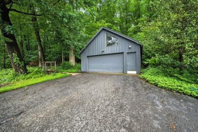 182 Musconetcong River Rd, Lebanon Twp, NJ 07882 - detached garage with a forest view