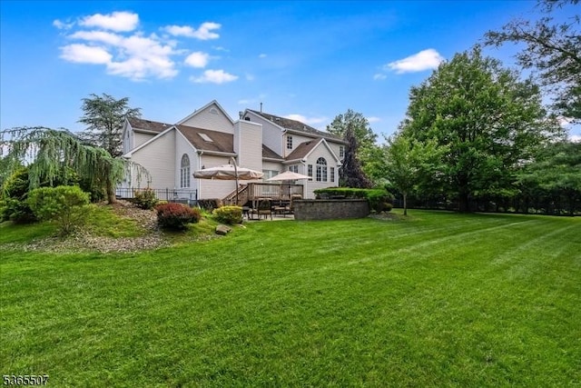33 Gates Pl, Wayne Twp, NJ 07470 - back of property with a yard and a deck