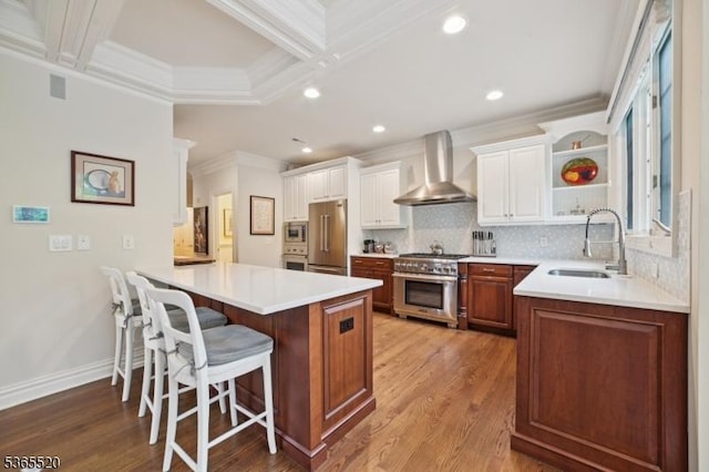 27 Green Way, New Providence Boro, NJ 07974 - kitchen featuring wall chimney exhaust hood, premium appliances, a peninsula, a kitchen breakfast bar, and ornamental molding
