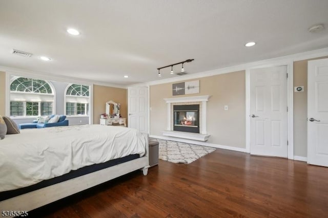 51 Greenbrook Rd, Middlesex Boro, NJ 08846 - bedroom featuring crown molding, wood finished floors, recessed lighting, a glass covered fireplace, and rail lighting