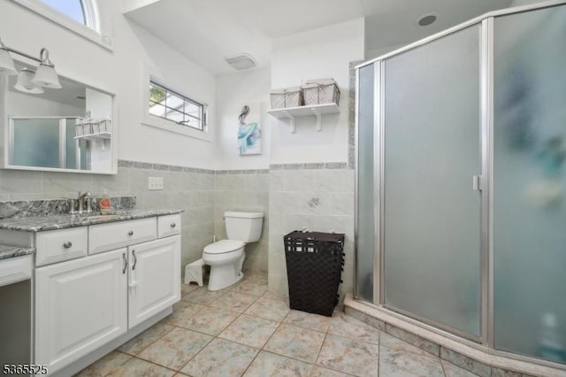 51 Greenbrook Rd, Middlesex Boro, NJ 08846 - bathroom with vanity, a stall shower, tile walls, and wainscoting
