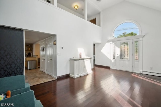 51 Greenbrook Rd, Middlesex Boro, NJ 08846 - entrance foyer with high vaulted ceiling, a baseboard radiator, and wood finished floors