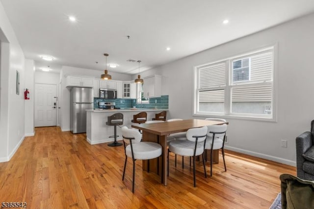 98 S Burnett St, East Orange City, NJ 07018 - dining area with light wood-style flooring and recessed lighting