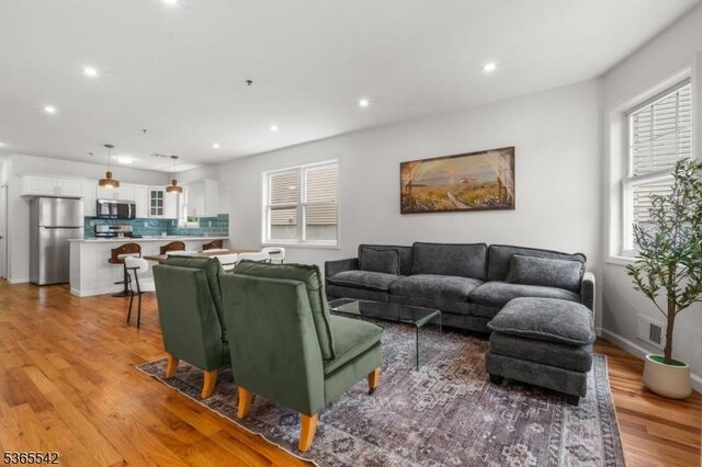 98 S Burnett St, East Orange City, NJ 07018 - living room with light wood finished floors and recessed lighting