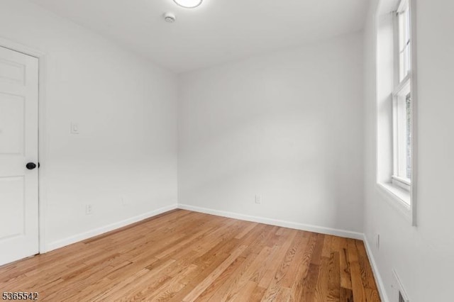98 S Burnett St, East Orange City, NJ 07018 - spare room with light wood finished floors and a smoke detector