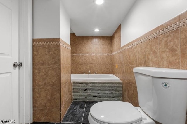 98 S Burnett St, East Orange City, NJ 07018 - bathroom featuring tile walls, a garden tub, tile patterned flooring, and recessed lighting