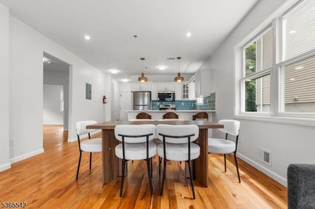98 S Burnett St, East Orange City, NJ 07018 - dining room with light wood-style floors, electric panel, and recessed lighting