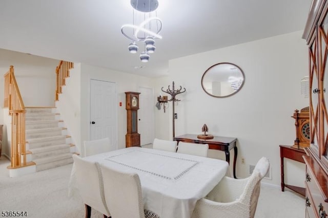 1203 Magnolia Ct, Washington Twp, NJ 07840 - dining area featuring light colored carpet, stairway, and a chandelier