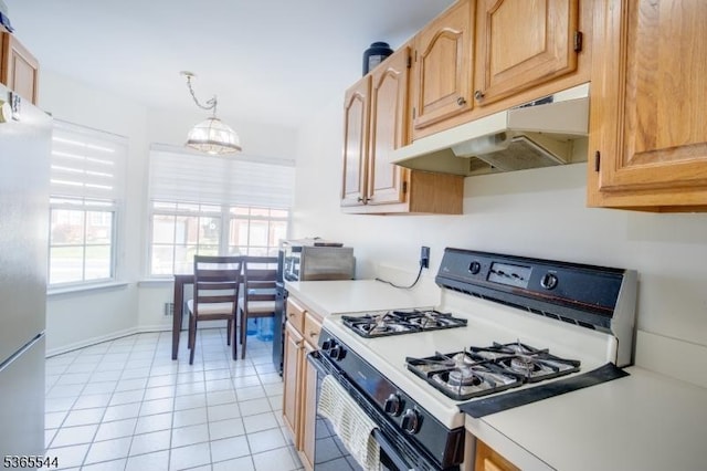 1203 Magnolia Ct, Washington Twp, NJ 07840 - kitchen with white gas range, under cabinet range hood, light countertops, freestanding refrigerator, and light tile patterned flooring