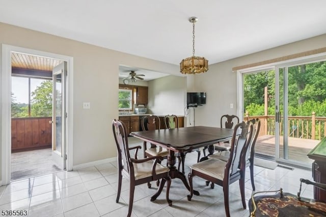215 Sussex Ave, Andover Twp, NJ 07860 - dining space featuring a chandelier, light tile patterned floors, and ceiling fan