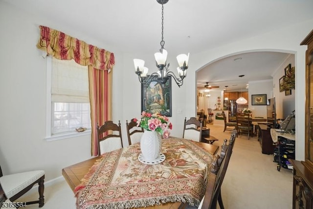 63 Ridgeview Ln, Mount Arlington Boro, NJ 07856 - dining area featuring arched walkways, carpet flooring, a chandelier, and a ceiling fan