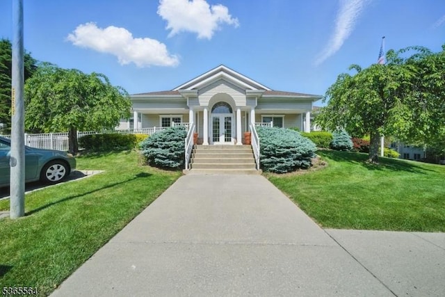 63 Ridgeview Ln, Mount Arlington Boro, NJ 07856 - view of front of house featuring french doors, a front yard, and a porch