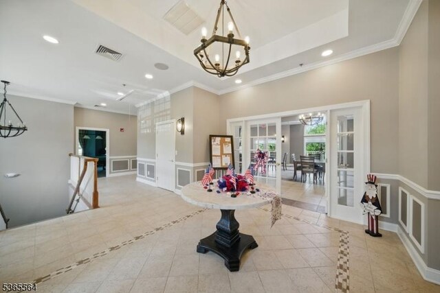 63 Ridgeview Ln, Mount Arlington Boro, NJ 07856 - tiled dining area with a chandelier, french doors, inlaid floor details, a decorative wall, and recessed lighting
