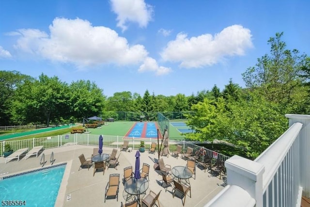 63 Ridgeview Ln, Mount Arlington Boro, NJ 07856 - community pool with a tennis court, a patio area, and view of scattered trees