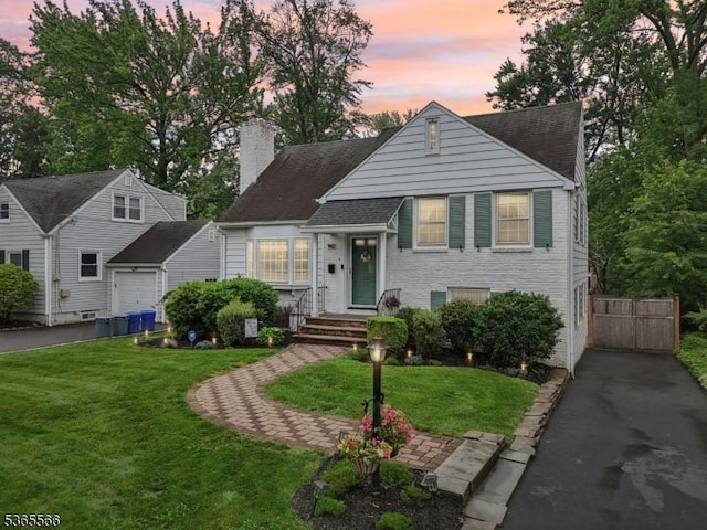 942 Summit Ave, Westfield Town, NJ 07090 - view of front of home with a chimney and asphalt driveway