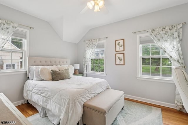 942 Summit Ave, Westfield Town, NJ 07090 - bedroom with multiple windows, wood finished floors, vaulted ceiling, and a ceiling fan