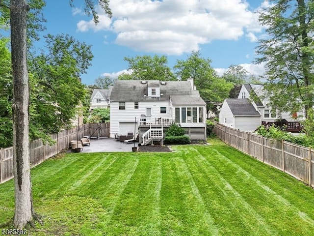 942 Summit Ave, Westfield Town, NJ 07090 - rear view of house with a deck, a patio, and a fenced backyard