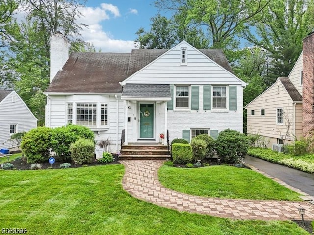 942 Summit Ave, Westfield Town, NJ 07090 - view of front of home featuring a front lawn and a chimney