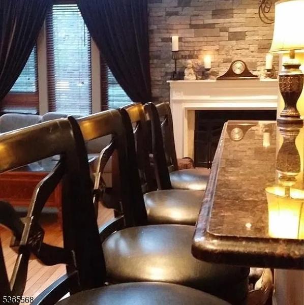 705 Mainsail Ln, Secaucus Town, NJ 07094 - living area featuring plenty of natural light and a fireplace
