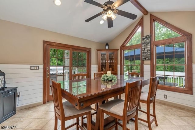 114 Fawn Ridge Dr, Long Hill Twp, NJ 07946 - dining space featuring vaulted ceiling, ceiling fan, light tile patterned flooring, wooden walls, and wainscoting