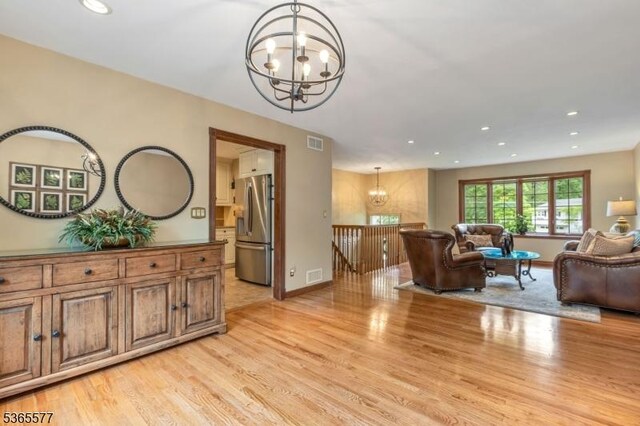 114 Fawn Ridge Dr, Long Hill Twp, NJ 07946 - living area with a chandelier, light wood-type flooring, and recessed lighting
