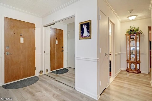 2 Claridge Dr Unit 7Lw, Verona Twp, NJ 07044 - foyer featuring light wood-style flooring, ornamental molding, and a textured ceiling