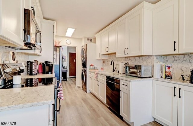 2 Claridge Dr Unit 7Lw, Verona Twp, NJ 07044 - kitchen featuring dishwasher, electric range oven, stainless steel microwave, stacked washer / dryer, and backsplash