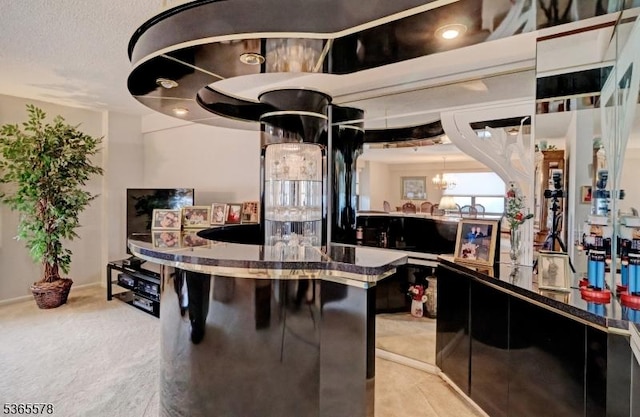 2 Claridge Dr Unit 7Lw, Verona Twp, NJ 07044 - bar featuring a chandelier and carpet flooring