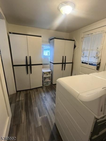 15 Fisk St, Belvidere Twp, NJ 07823 - washroom featuring cabinet space, dark wood-type flooring, and washer and dryer