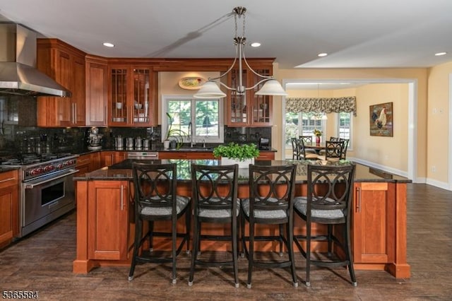 4 Wingover Farm Ct, Raritan Twp, NJ 08822 - bar area featuring wall chimney exhaust hood, high end stove, backsplash, recessed lighting, and dark wood-style flooring