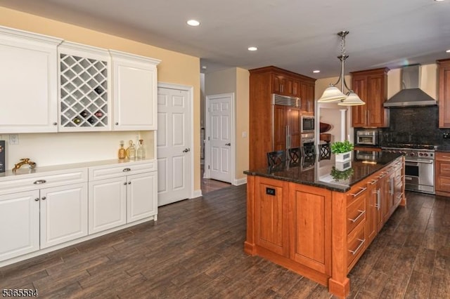 4 Wingover Farm Ct, Raritan Twp, NJ 08822 - kitchen featuring wall chimney exhaust hood, built in appliances, recessed lighting, dark wood-style floors, and a center island