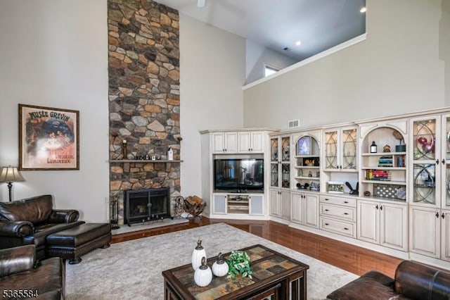 4 Wingover Farm Ct, Raritan Twp, NJ 08822 - living room with a high ceiling, dark wood-style flooring, and a stone fireplace