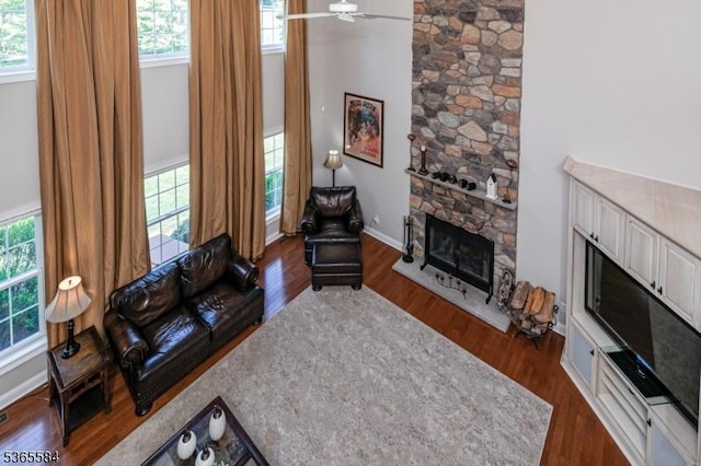 4 Wingover Farm Ct, Raritan Twp, NJ 08822 - living area featuring dark wood-style floors, a fireplace, healthy amount of natural light, and a ceiling fan