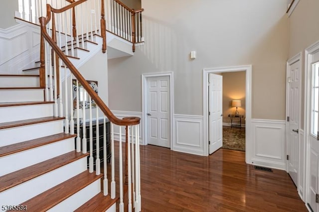 4 Wingover Farm Ct, Raritan Twp, NJ 08822 - stairs with wood finished floors, a high ceiling, a decorative wall, and wainscoting