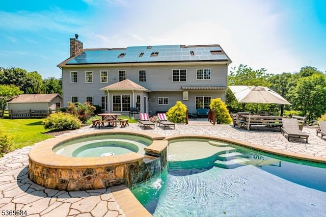 4 Wingover Farm Ct, Raritan Twp, NJ 08822 - back of house featuring a patio, roof mounted solar panels, and a chimney
