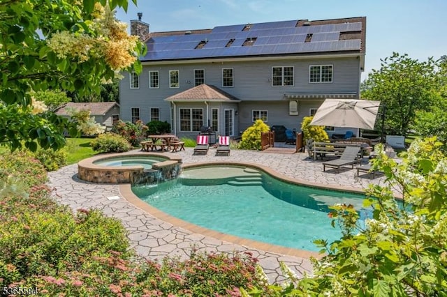 4 Wingover Farm Ct, Raritan Twp, NJ 08822 - back of house with a patio, solar panels, a chimney, and a pool with connected hot tub