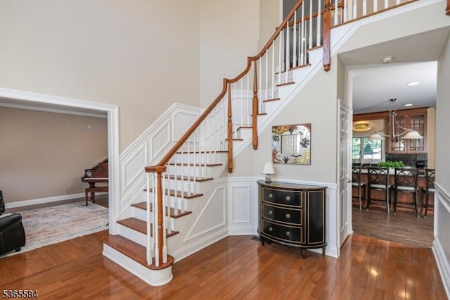 4 Wingover Farm Ct, Raritan Twp, NJ 08822 - staircase featuring wood-type flooring and a towering ceiling