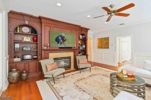10 Westminster Pl, Morris Twp, NJ 07960 - living area with wood finished floors, a high end fireplace, recessed lighting, a wainscoted wall, and a ceiling fan