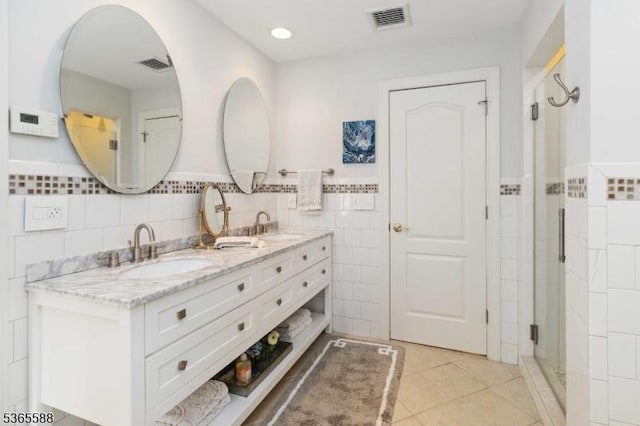 10 Westminster Pl, Morris Twp, NJ 07960 - bathroom with tile walls, double vanity, tile patterned floors, wainscoting, and a stall shower
