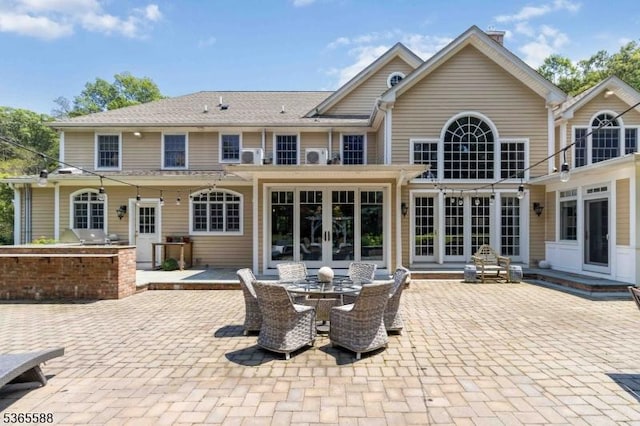 10 Westminster Pl, Morris Twp, NJ 07960 - back of property featuring french doors and a patio area