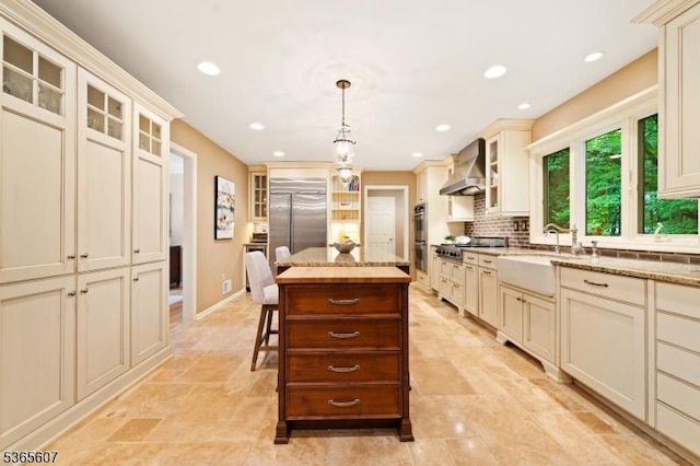 10 Kilmer Dr, Hillsborough Twp, NJ 08844 - kitchen with wall chimney range hood, cream cabinets, backsplash, recessed lighting, and glass insert cabinets
