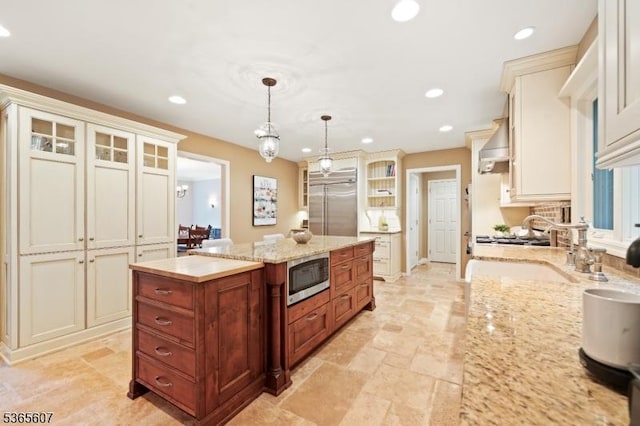 10 Kilmer Dr, Hillsborough Twp, NJ 08844 - kitchen featuring built in appliances, a kitchen island, recessed lighting, glass insert cabinets, and pendant lighting