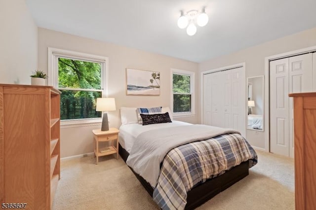 10 Kilmer Dr, Hillsborough Twp, NJ 08844 - bedroom featuring light colored carpet and two closets