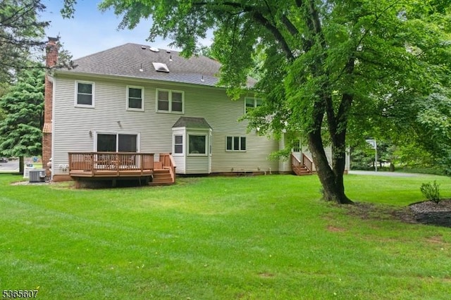 10 Kilmer Dr, Hillsborough Twp, NJ 08844 - back of property featuring a wooden deck, a chimney, a yard, and entry steps