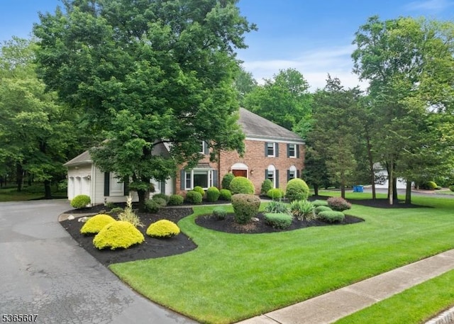 10 Kilmer Dr, Hillsborough Twp, NJ 08844 - colonial inspired home with a front yard, an attached garage, brick siding, and asphalt driveway