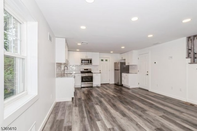 1489 Morris Ave, Union Twp, NJ 07083 - unfurnished living room featuring plenty of natural light, recessed lighting, and dark wood finished floors