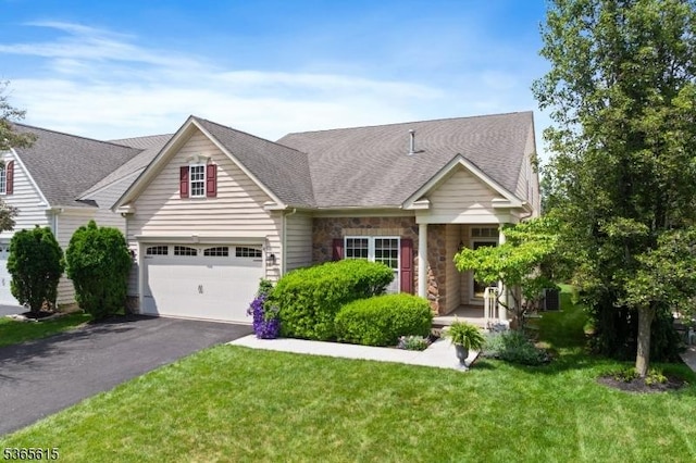 7 Thornton St, Hillsborough Twp, NJ 08844 - view of front of property with driveway, a front yard, stone siding, and a shingled roof
