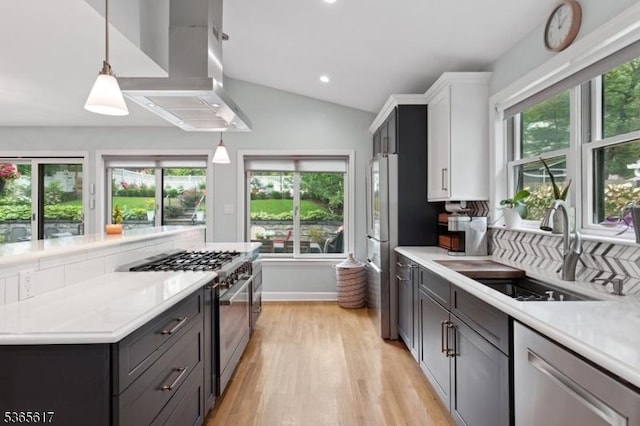 17 Lowell Ave, West Orange Twp, NJ 07052 - kitchen with stainless steel appliances, island range hood, light countertops, light wood finished floors, and recessed lighting