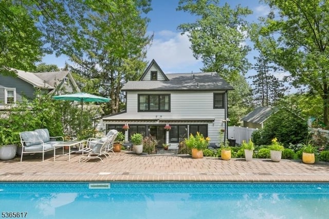 17 Lowell Ave, West Orange Twp, NJ 07052 - back of house featuring a patio and an outdoor pool