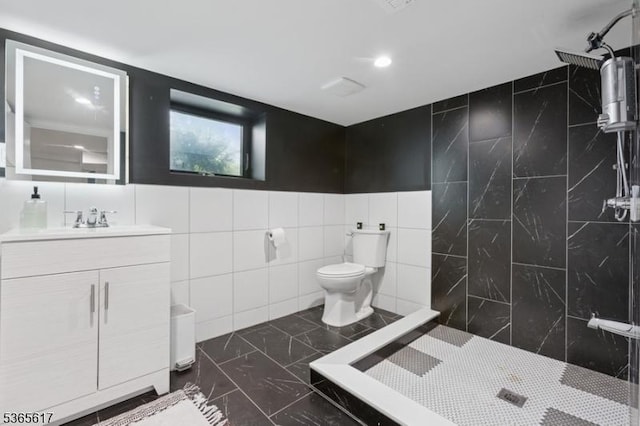 17 Lowell Ave, West Orange Twp, NJ 07052 - bathroom featuring tile walls, vanity, tiled shower, and marble finish floors